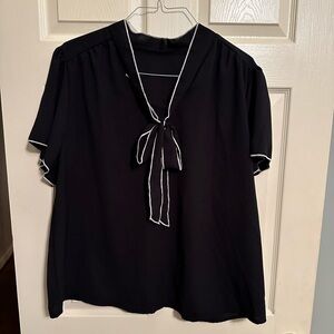 Black with cream trim and bow at neck